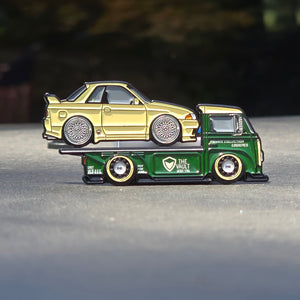 Model car on a green truck with a blurred background